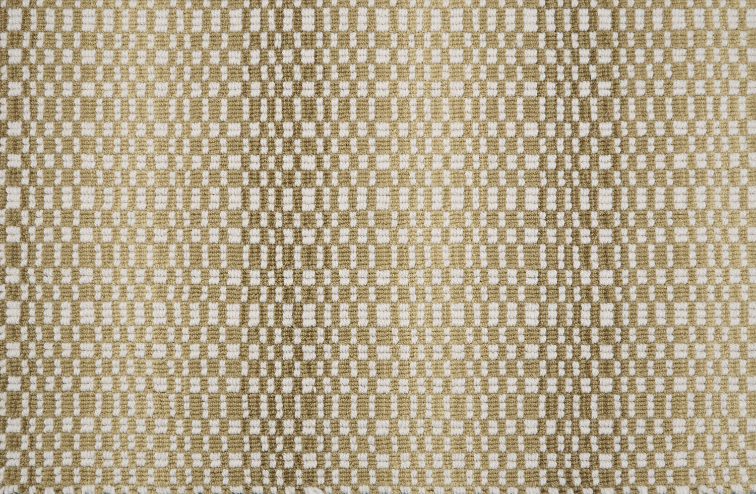 Broadloom carpet with a white checkerboard pattern with an ombré effect in shades of tan. 
