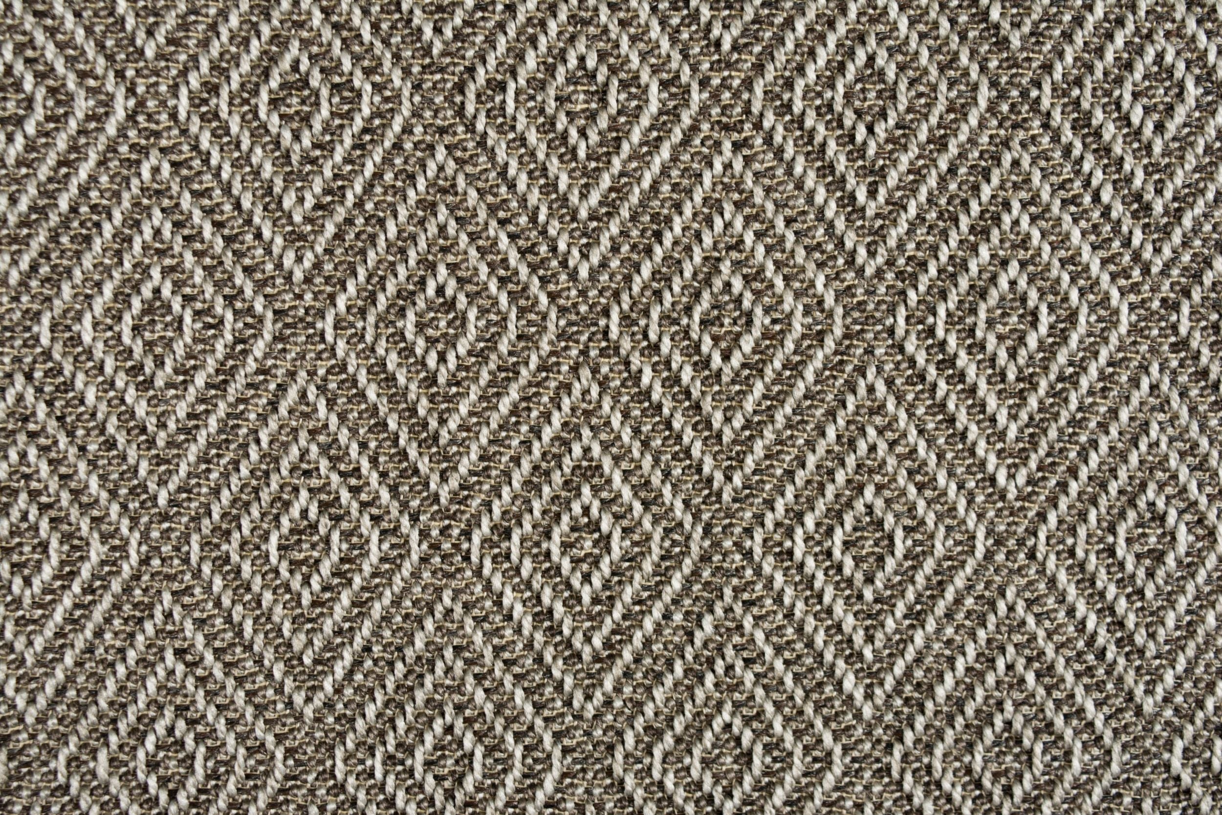 Broadloom carpet in a raised diamond pattern in brown