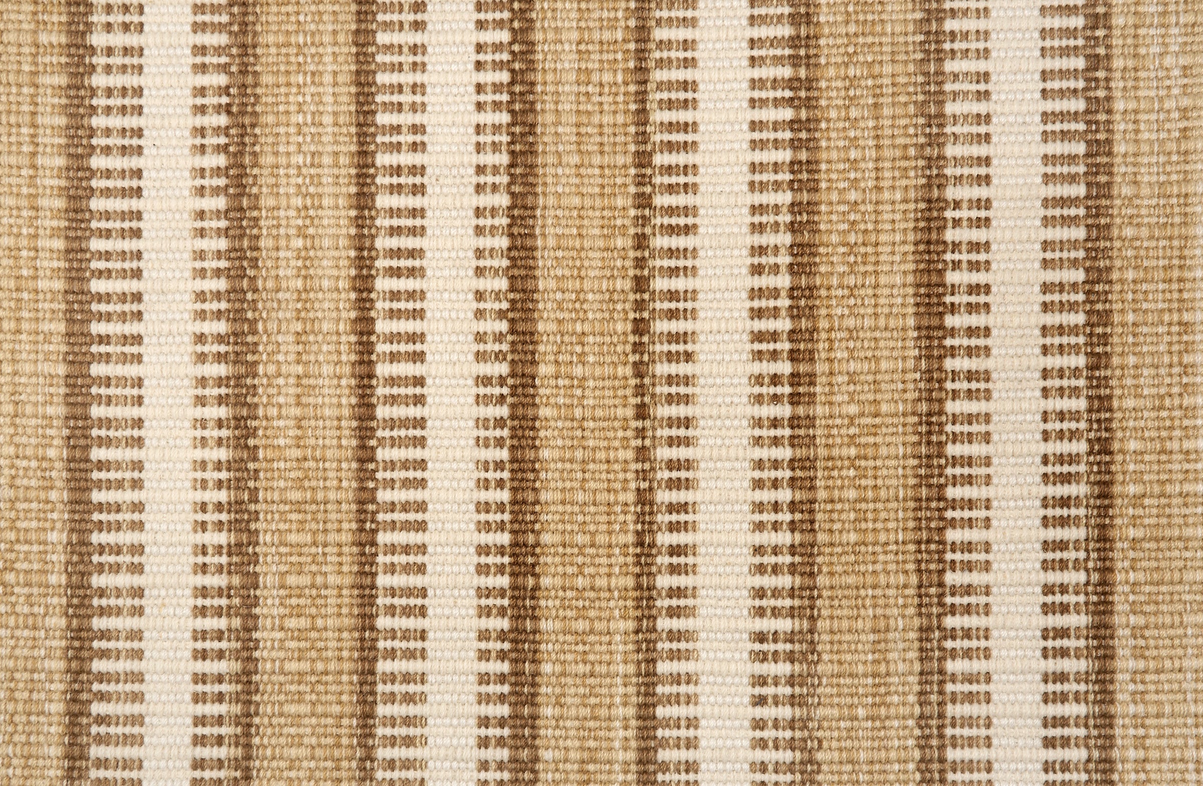 Broadloom carpet in a flatwoven stripe in brown, tan and cream. 