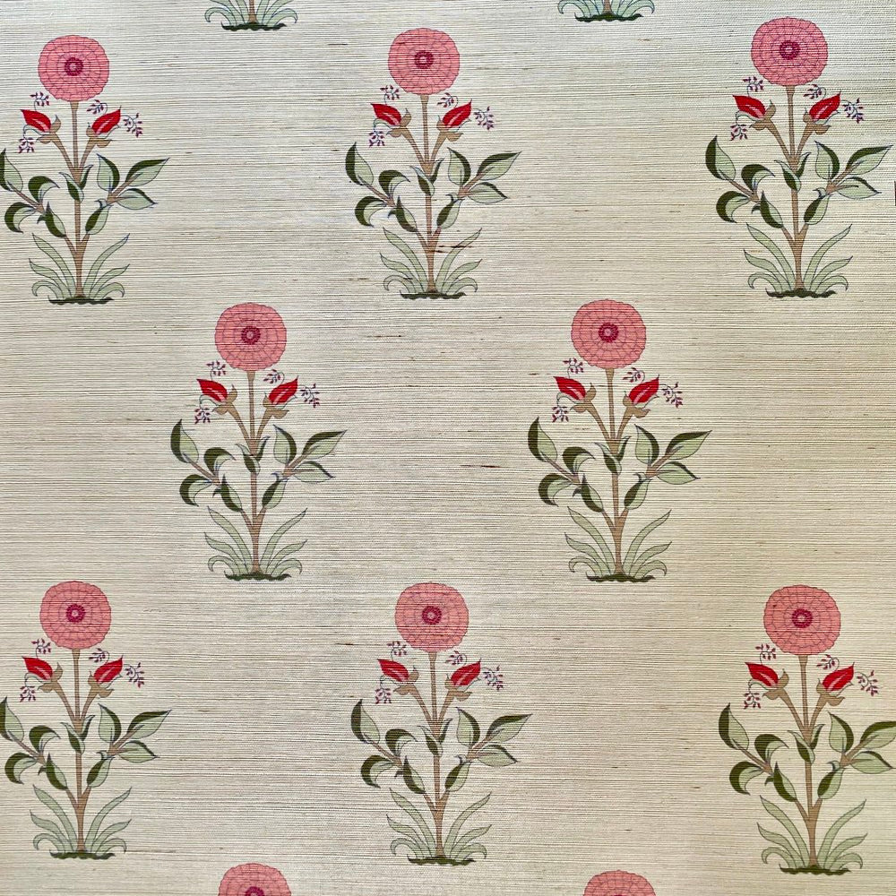 Detail of a large scale floral pattern in pink and shades of green.