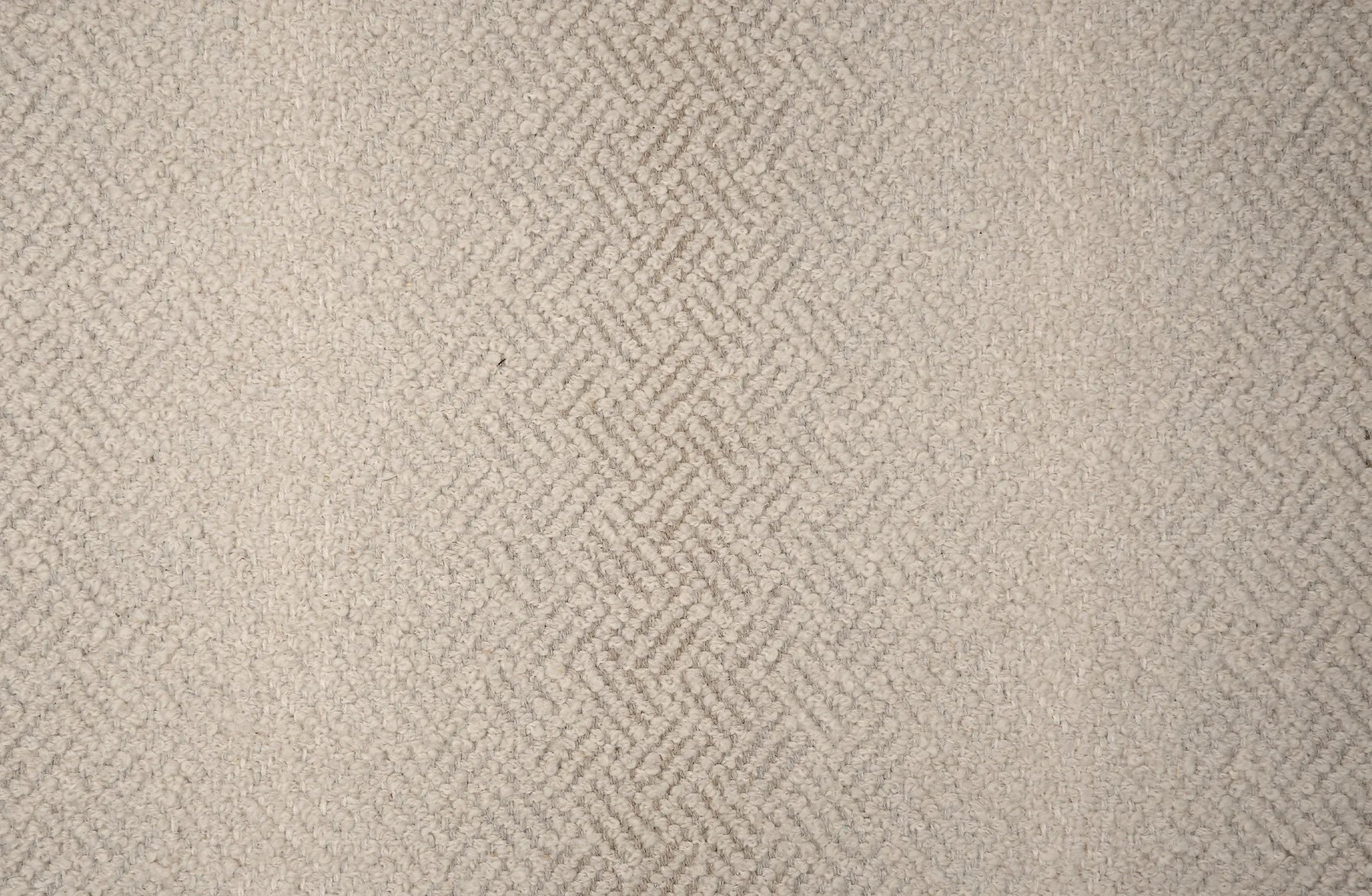 Broadloom with a geometric pattern on an ombré background in beige.