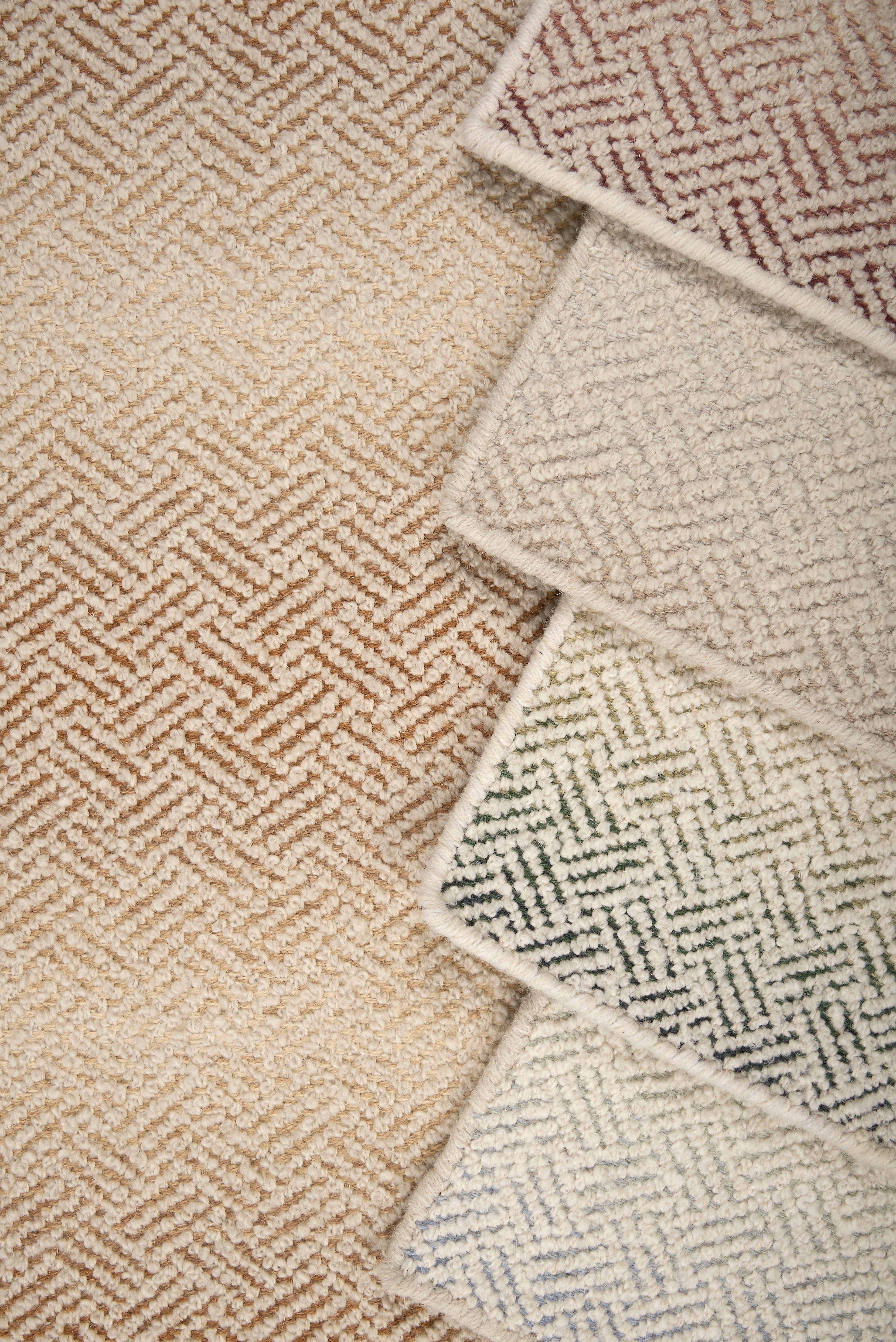 Close-up of textured carpet swatches with geometric pattern