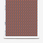 Wallpaper roll with small scale watercolor floral in blue and orange.
