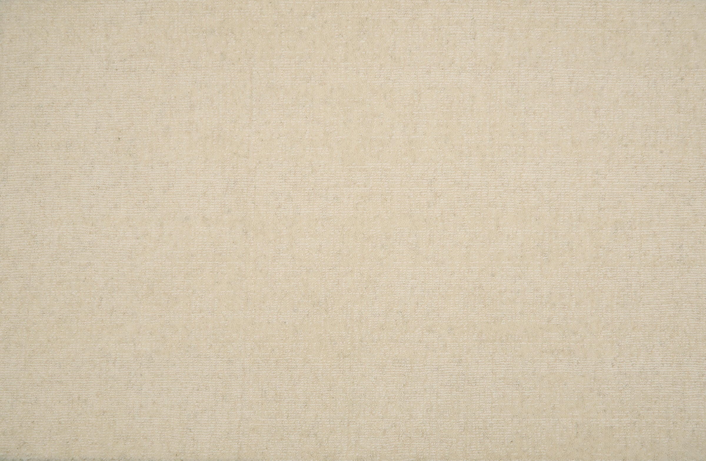 Broadloom carpet in solid ivory.