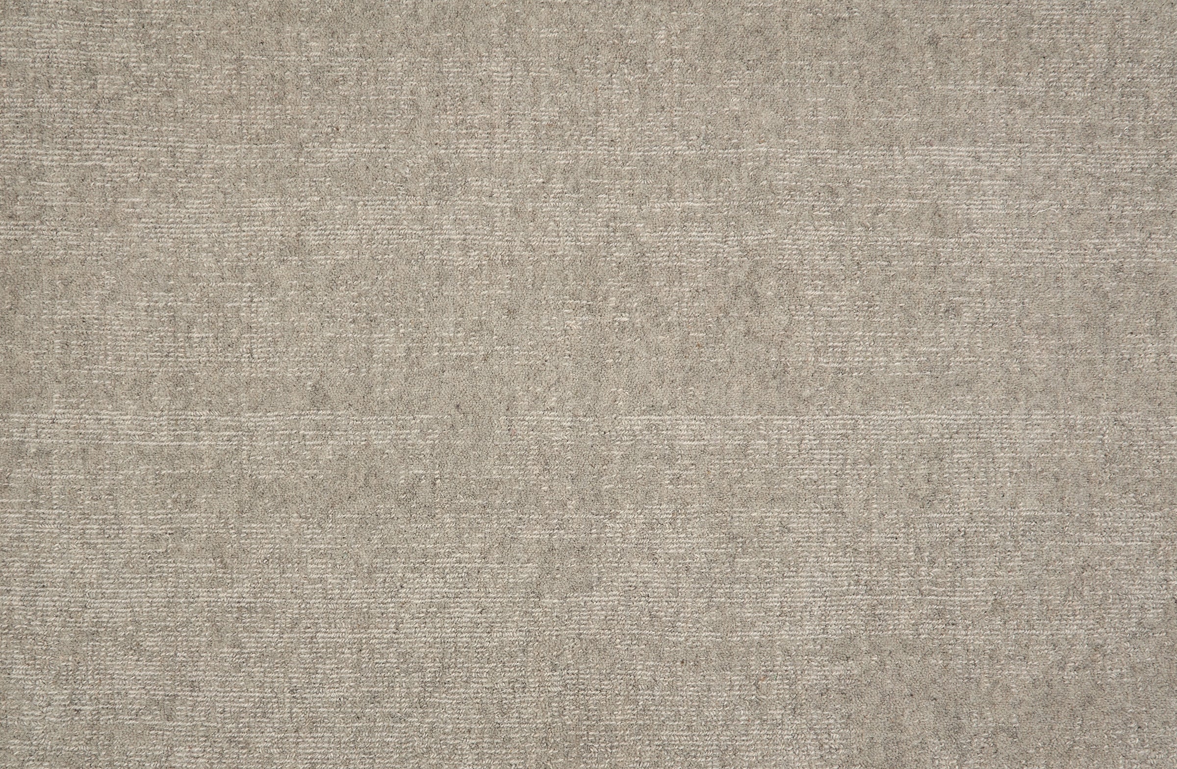 Broadloom carpet in solid greige.