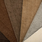 Broadloom carpet in an array of solid neutral colors.