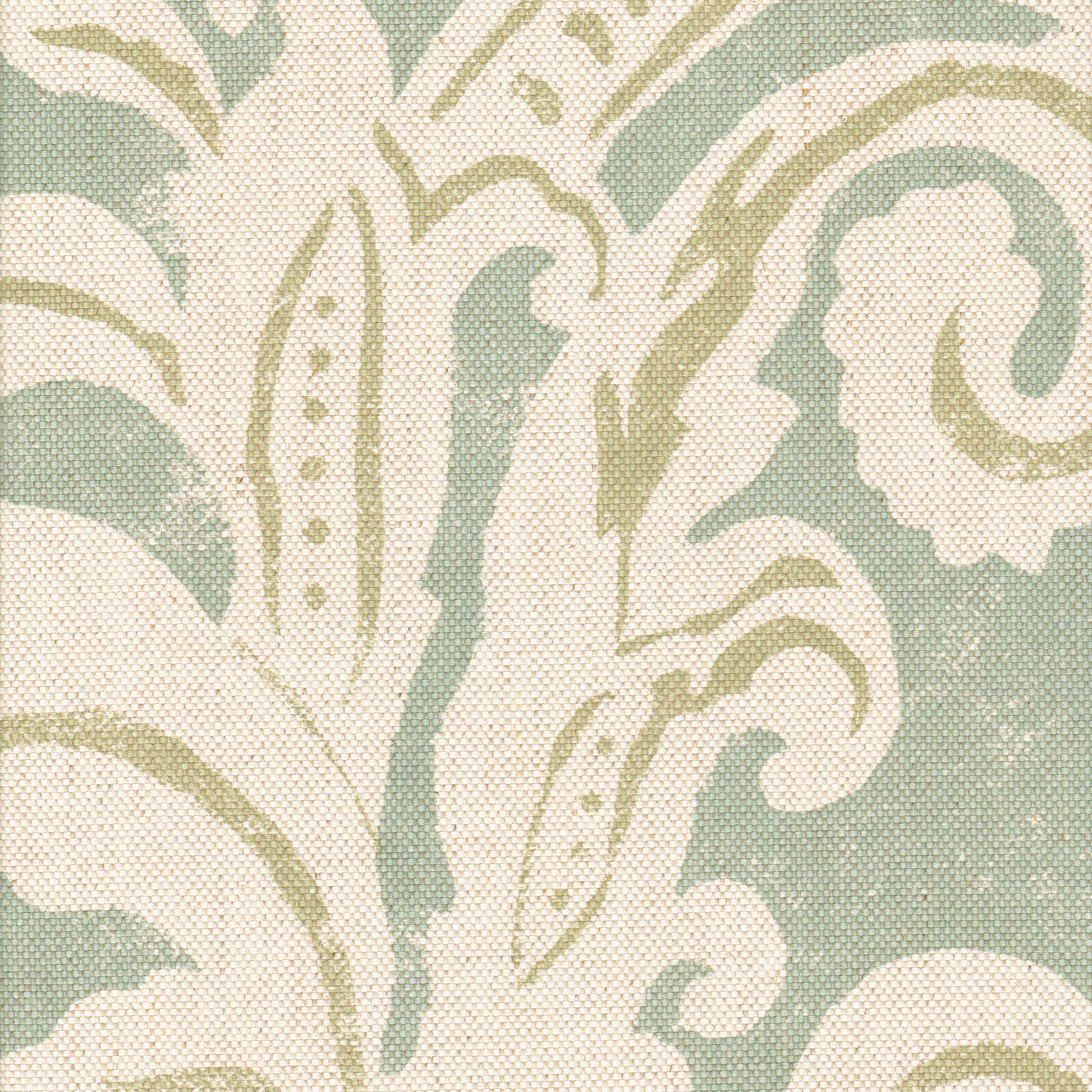 Detail of fabric in a floral damask print in cream and light green on a turquoise field.