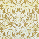 Detail of fabric in a floral damask print in white and yellow on a brown field.