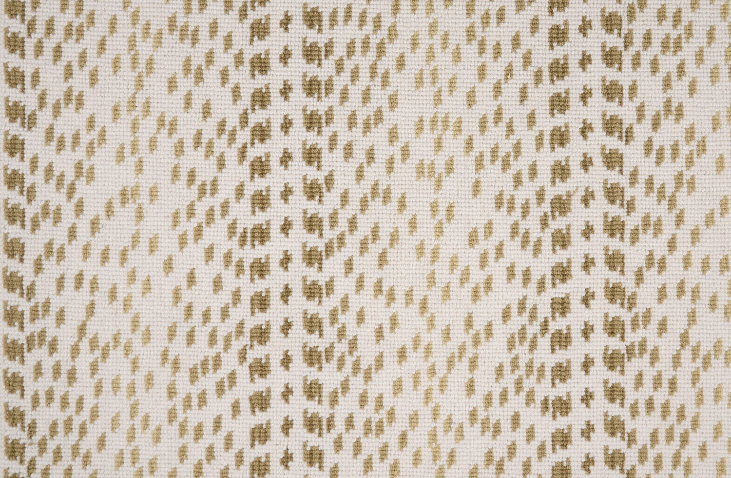Broadloom carpet with a dashed stripe in shades of tan on a cream field. 