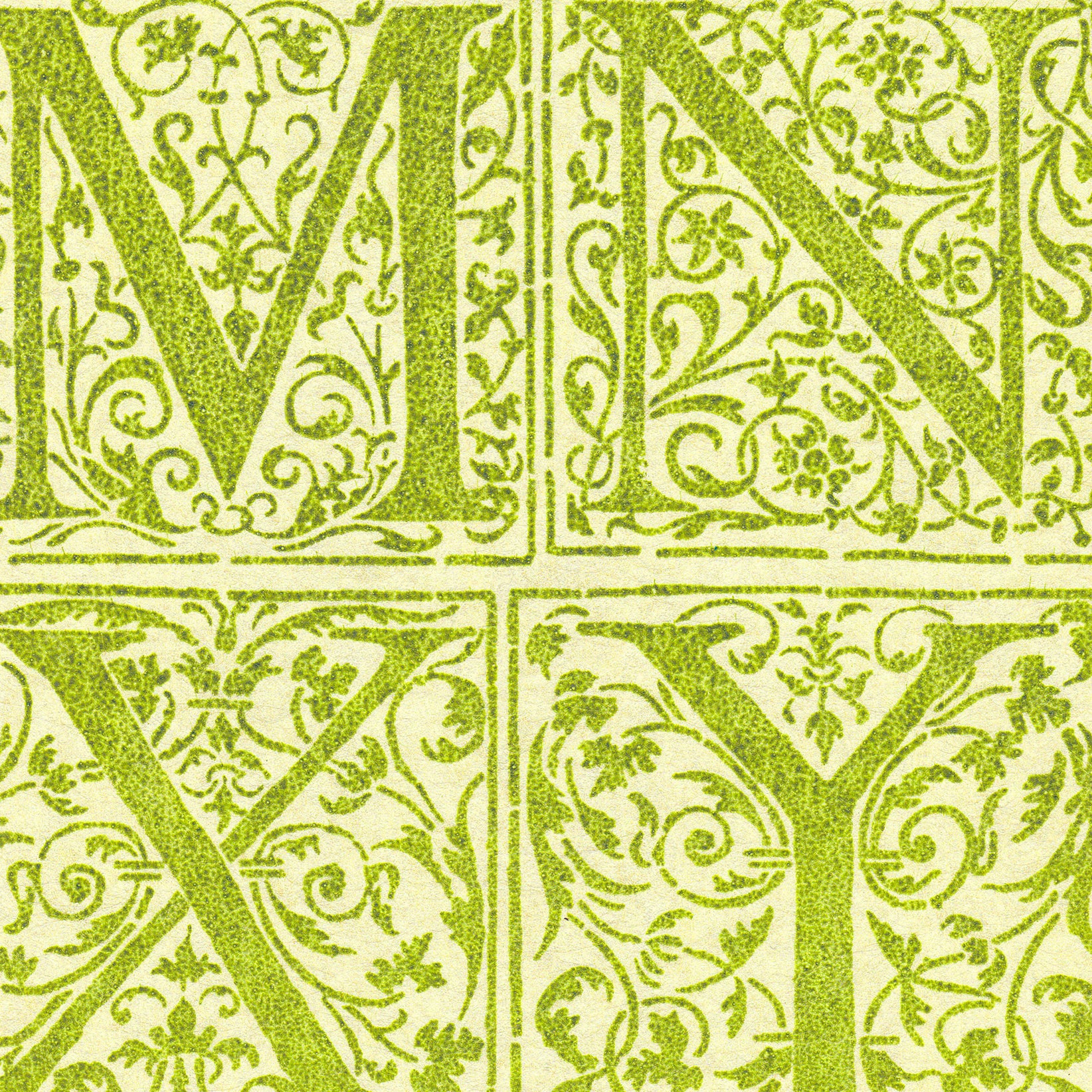 Detail of wallpaper in a playful alphabet grid print in green on a light green field.