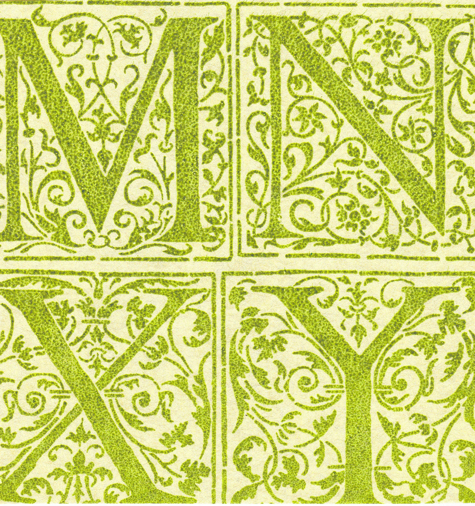 Detail of wallpaper in a playful alphabet grid print in green on a light green field.