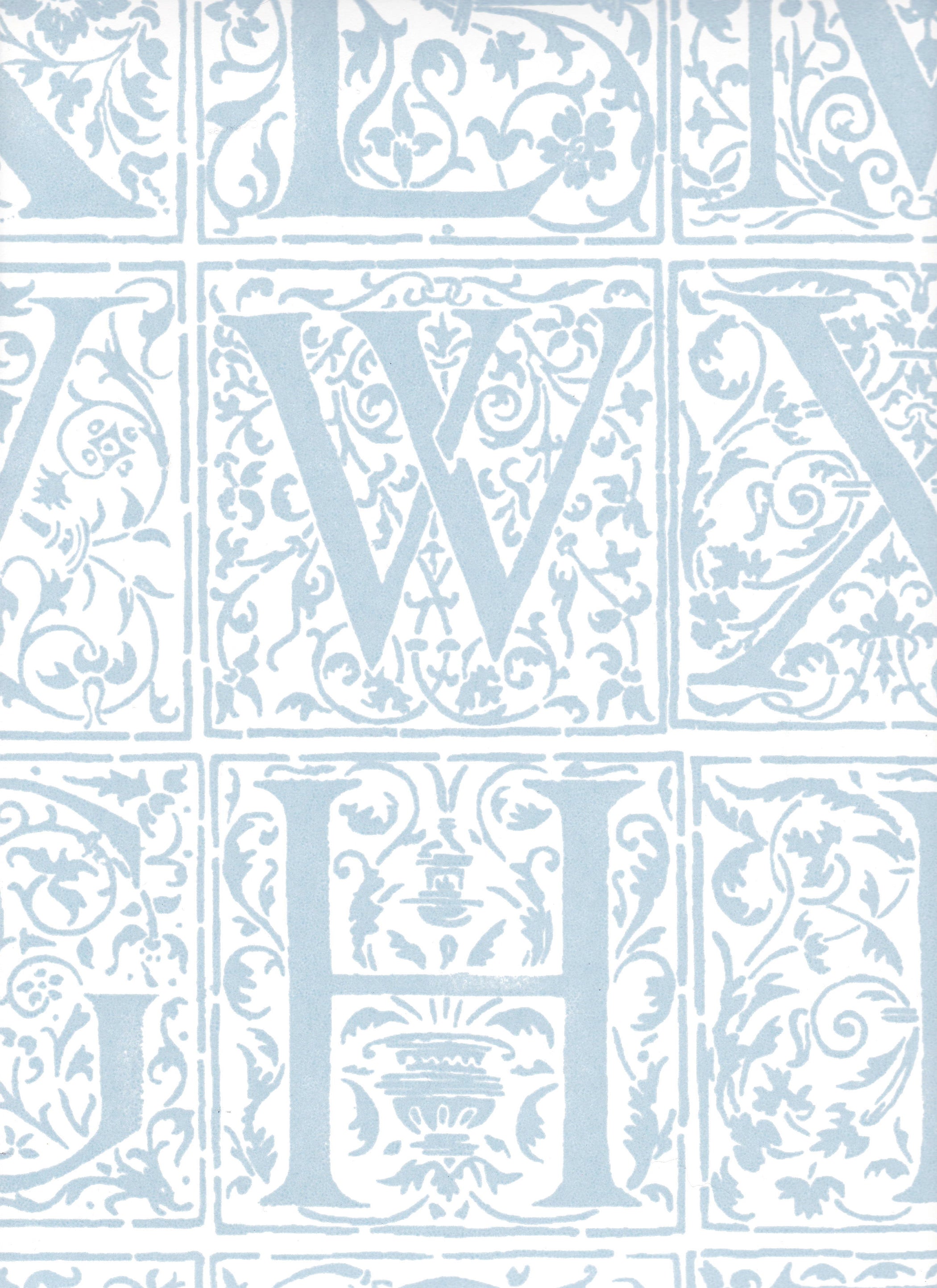 Detail of wallpaper in a playful alphabet grid print in light blue on a white field.