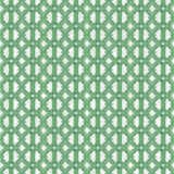 Detail of wallpaper in an intricate lattice print in green on a cream field.