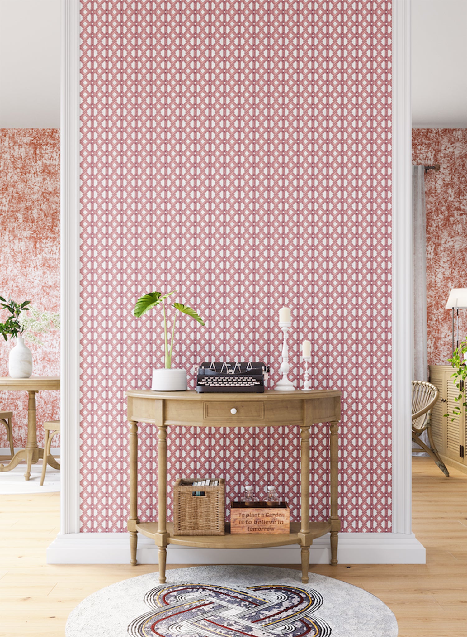 A maximalist living space with an accent wall papered in an intricate lattice print in pink on a cream field.