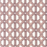 Detail of fabric in an intricate lattice print in light pink on a cream field.