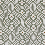 Detail of fabric in a floral damask print in white and rust on a sage field.