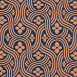 Detail of fabric in a floral damask print in orange on a dark blue field.