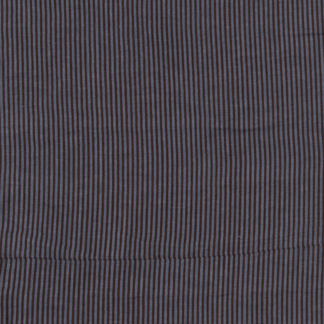 Detail of fabric in a stripe print in brown and navy.