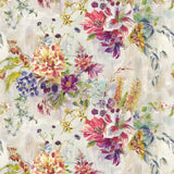 Detail of fabric in a painterly floral print in a variety of colors on a mottled cream field.