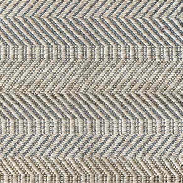 Broadloom carpet sample in a neutral herringbone pattern