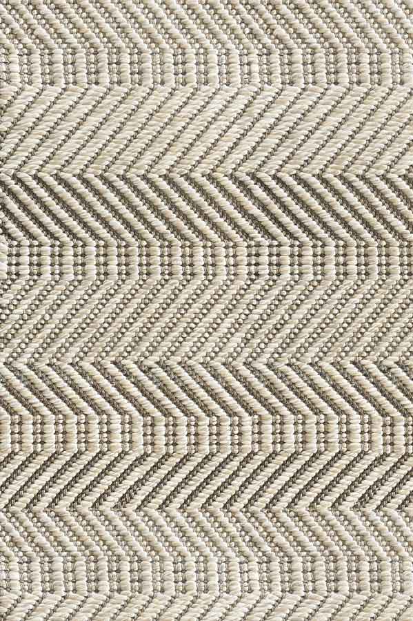 Broadloom carpet sample in a ivory, tan and taupe herringbone pattern