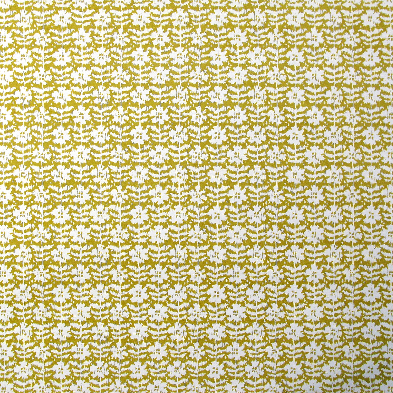 Detail of wallpaper in a floral grid print in white on a mustard field.