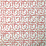 Detail of wallpaper in a floral grid print in white on a dusty rose field.