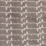 Detail of fabric in an abstract curvilinear stripe in black on a tan field.