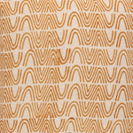 Detail of fabric in an abstract curvilinear stripe in orange on a tan field.