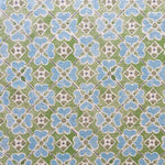 Detail of fabric in a floral lattice print in blue, green, brown and white.