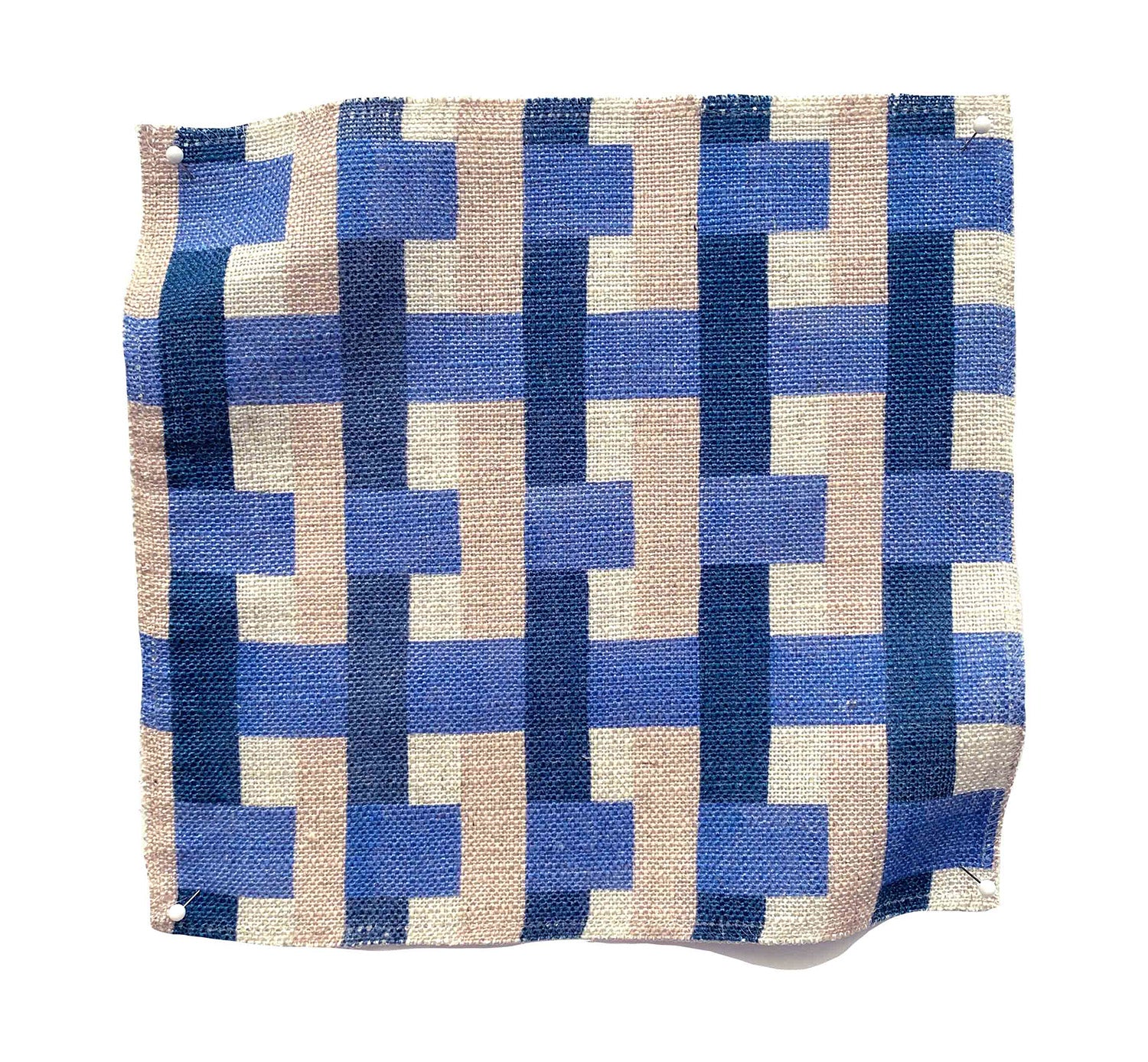 Square fabric swatch in an interlocking checked pattern in shades of tan, blue and navy.