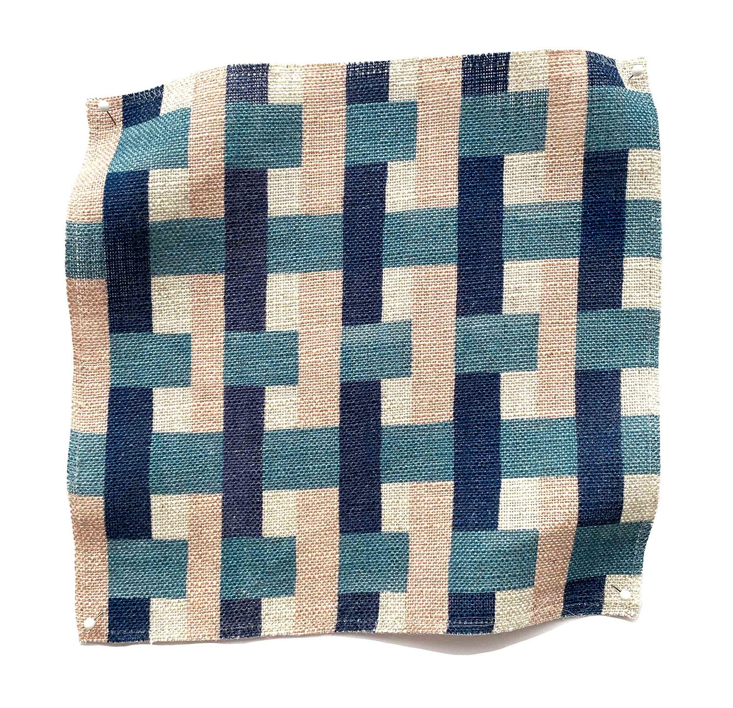 Square fabric swatch in an interlocking checked pattern in shades of pink, blue and navy.