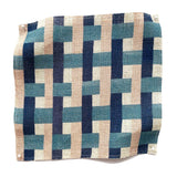 Square fabric swatch in an interlocking checked pattern in shades of pink, blue and navy.