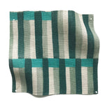 Square fabric swatch in an interlocking striped pattern in shades of turquoise, green and cream.