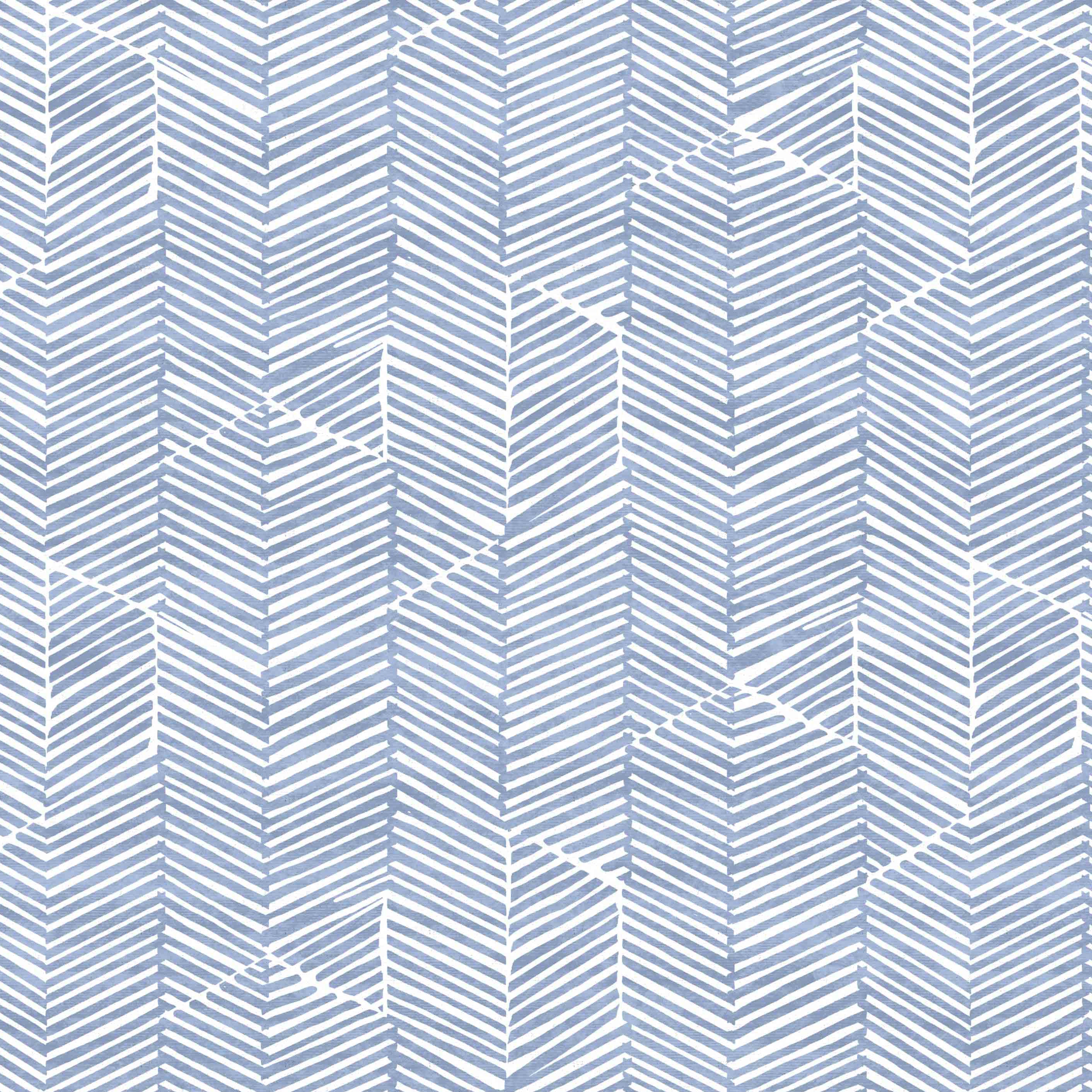 Detail of fabric in a dense herringbone print in blue on a white field.