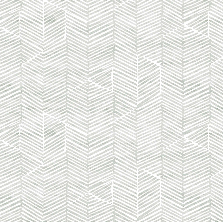 Detail of fabric in a dense herringbone print in light gray on a white field.