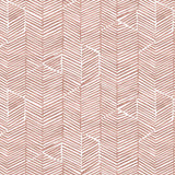 Detail of fabric in a dense herringbone print in brown on a white field.