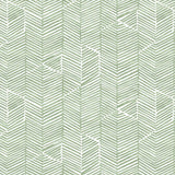 Detail of fabric in a dense herringbone print in sage on a white field.