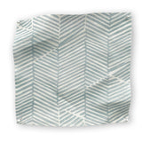 Square fabric swatch in a dense herringbone print in blue-gray on a white field.