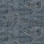 Detail of fabric in a dense herringbone print in navy on a tan field.