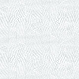 Detail of wallpaper in a dense herringbone print in light gray on a white field.