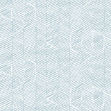 Detail of wallpaper in a dense herringbone print in light blue on a white field.
