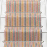 Striped flatweave runner in tan blue green on white staircase