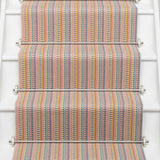 Striped flatweave runner in tan blue green on white staircase