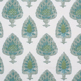 Detail of fabric in a botanical damask print in shades of green and blue on a cream field.