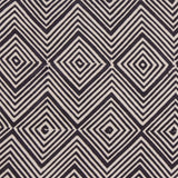 Detail of fabric in an abstract diamond print in black on a greige field.