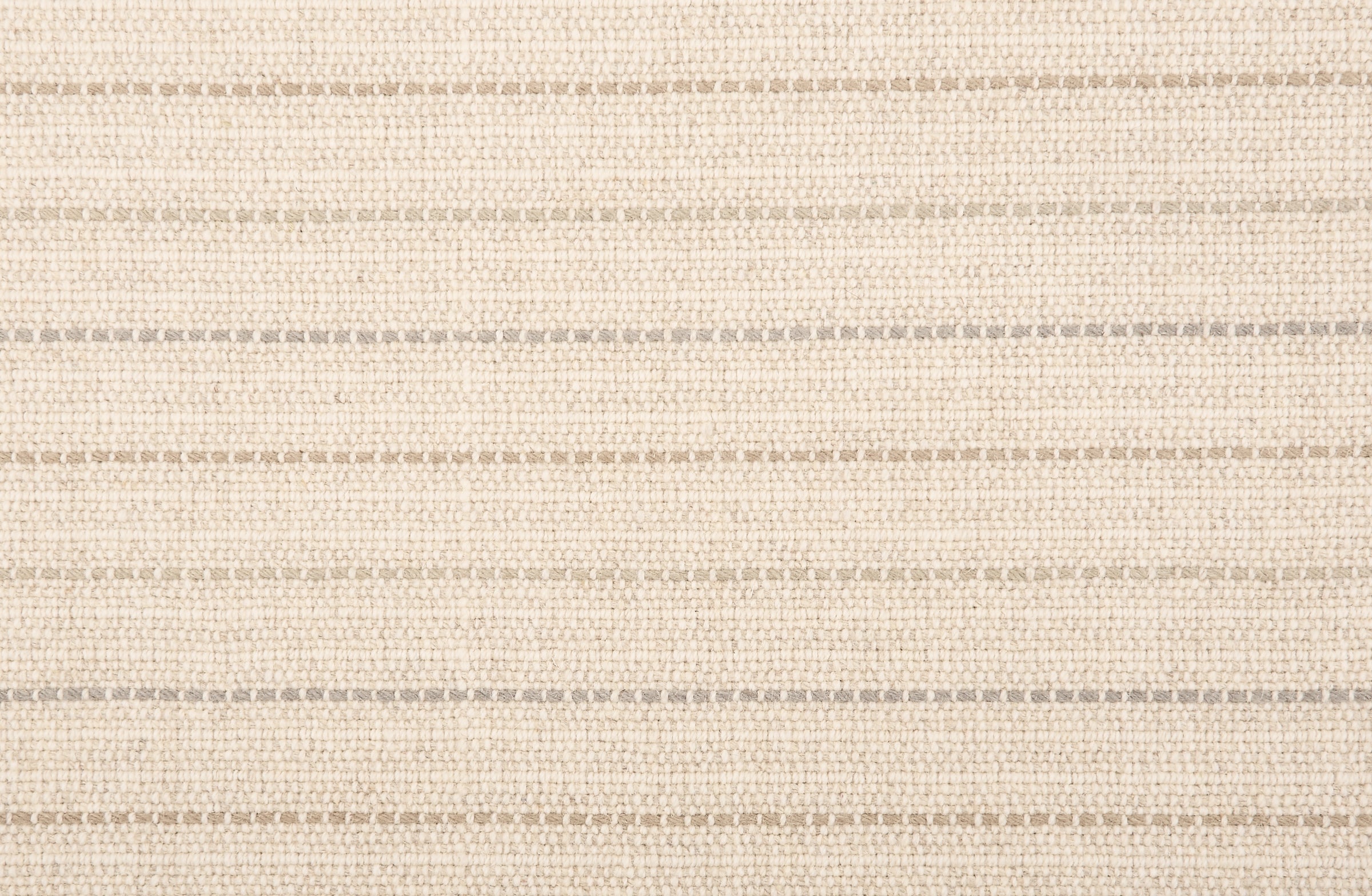 Broadloom carpet with a cream field and widely spaced dashed stripes in shades of  taupe and grey.