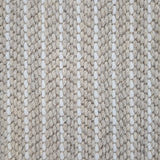 Close-up of a broadloom carpet with vertical stripes in beige and white.