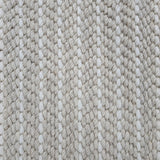 Close-up of a broadloom carpet with vertical stripes in beige and white