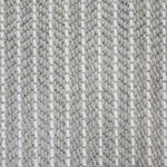 Close-up of a broadloom carpet with vertical stripes in grey and white.